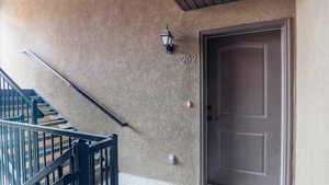 View of exterior entry featuring stucco siding