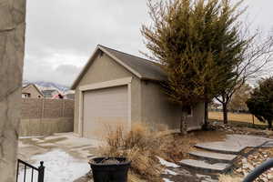 Garage with fence and driveway