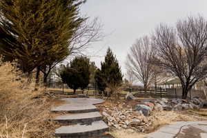 View of yard featuring fence