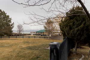 View of yard featuring fence and a gazebo