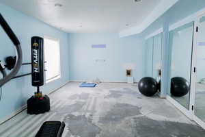 Exercise area featuring baseboards