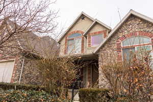 View of front of property with stone siding