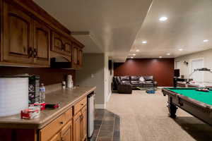 Rec room featuring dark colored carpet, billiards, baseboards, and recessed lighting