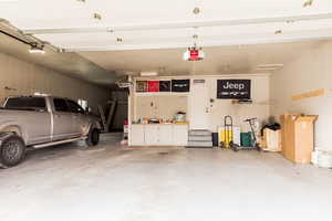 Garage featuring a garage door opener