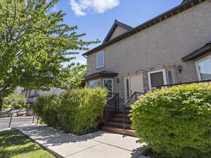 Exterior space featuring stucco siding