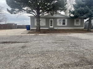 View of front of property featuring fence