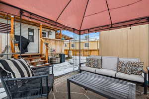 View of patio featuring a gazebo and an outdoor living space