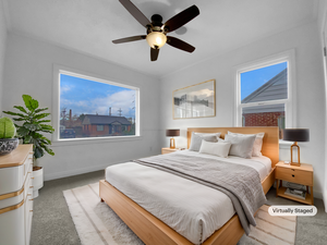 Bedroom with carpet, ceiling fan, and baseboards