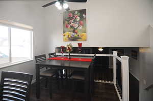 Dining space featuring baseboards, a ceiling fan, and wood finished floors