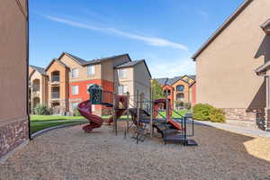 Community jungle gym with a residential view