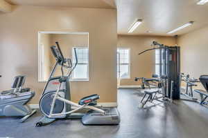 Workout area featuring baseboards