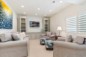 Living room featuring carpet and recessed lighting