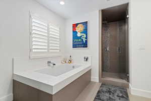 Full bathroom with a garden tub, recessed lighting, a stall shower, a sink, and tile patterned floors