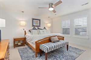 Bedroom featuring baseboards  and light colored carpet