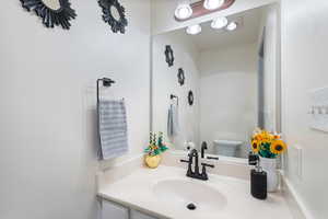 Bathroom with vanity and toilet