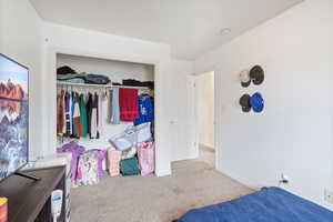 Bedroom featuring a closet and carpet