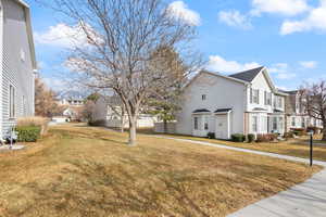 View of property exterior featuring a yard