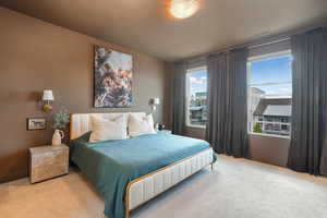Bedroom featuring visible vents and carpet flooring