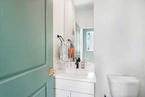 Half bath with toilet and vanity