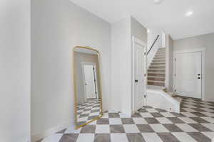 Interior space featuring stairway, recessed lighting, and baseboards