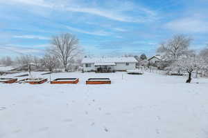 View of yard covered in snow