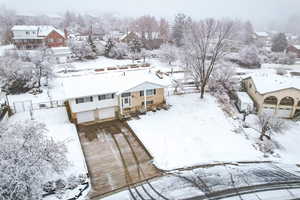 Snowy aerial view with a residential view