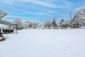 View of yard layered in snow