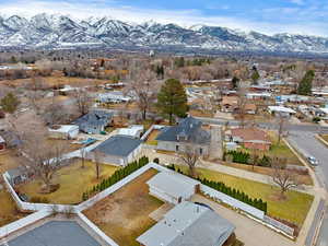 Drone / aerial view with a residential view and a mountain view