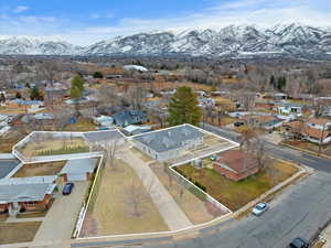 Birds eye view of property with a residential view and a mountain view