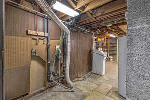 Unfinished basement with washer / dryer