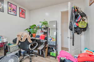 Office area with light wood-style flooring