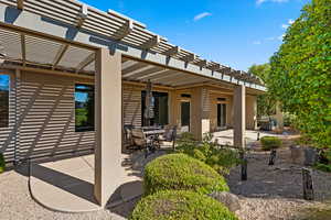 View of patio featuring a pergola and outdoor dining space