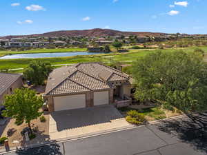 Aerial view of residential area with a water and mountain view and a golf club