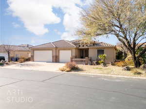 Mediterranean / spanish-style house featuring a garage, concrete driveway, stucco siding, and a tile roof