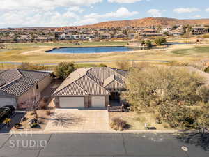 Aerial perspective of suburban area featuring a water and mountain view and a local golf course