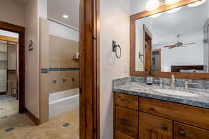 Bathroom featuring ceiling fan and vanity