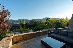 View of patio with an outdoor hangout area and a mountain view