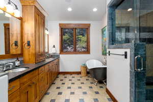 Bathroom with vanity and independent shower and bath