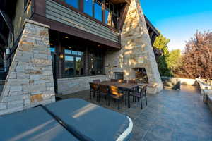 View of patio / terrace with an outdoor stone fireplace