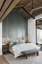 Bedroom with vaulted ceiling, wood finished floors, and wood ceiling