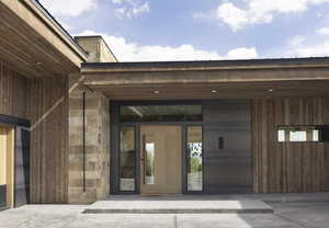 Property entrance featuring stone siding