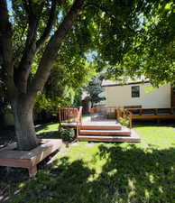 View of yard with a wooden deck