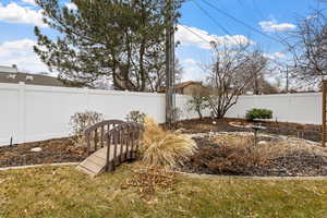 View of yard featuring a newly fenced backyard