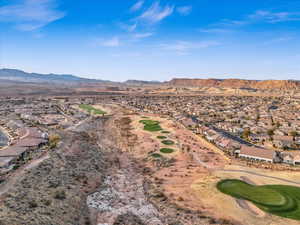 Aerial view with a residential view, a mountain view, and golf course view