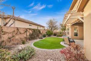 View of yard featuring a patio area, a fenced backyard, and a pergola