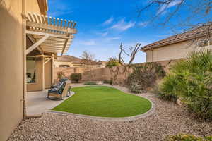 View of yard with a patio area, a fenced backyard, and a pergola