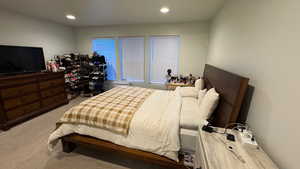 Bedroom featuring light colored carpet