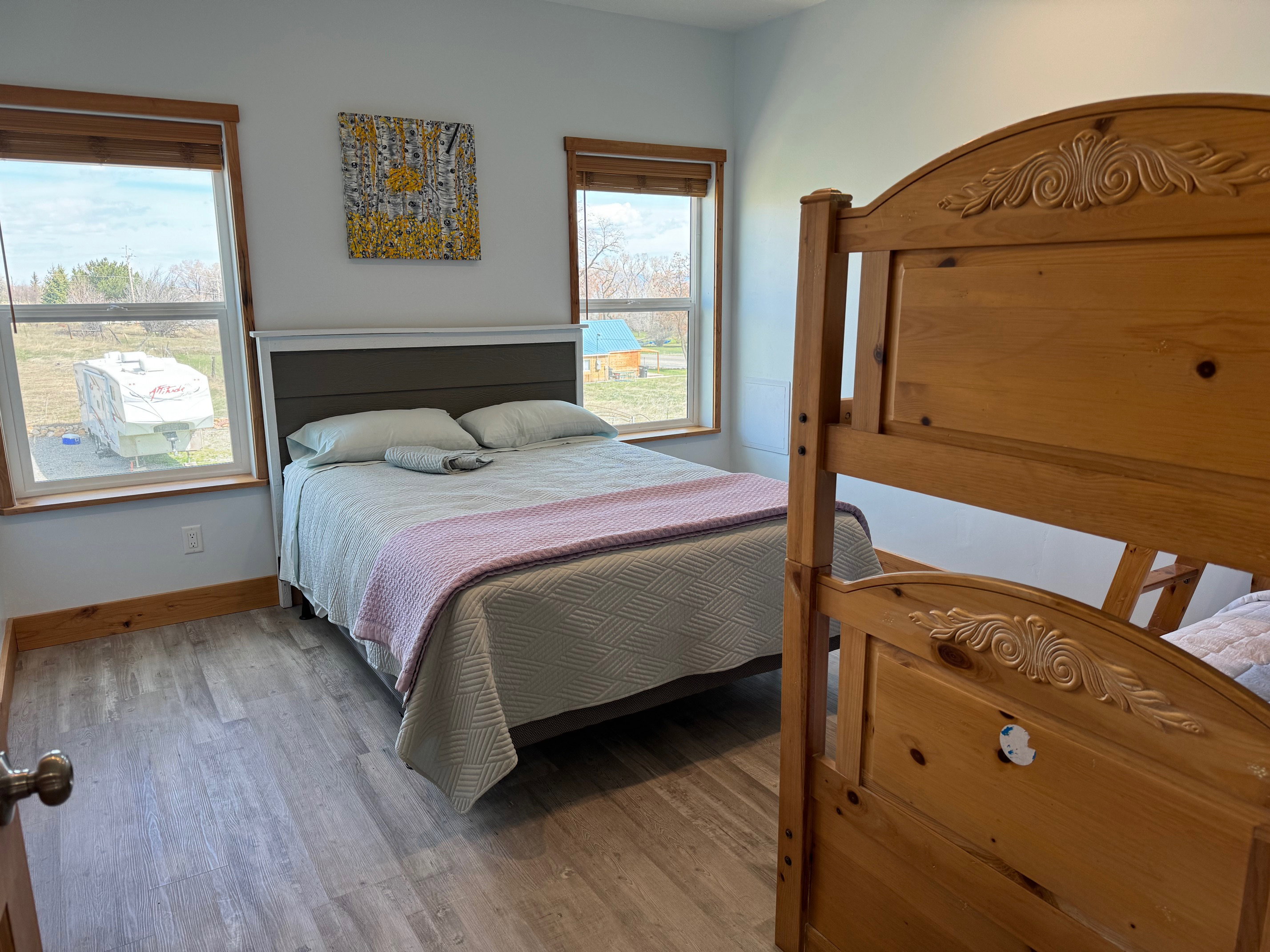 Bedroom featuring baseboards and wood finished floors