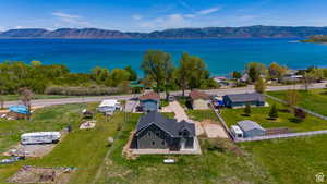 Drone / aerial view with a water and mountain view