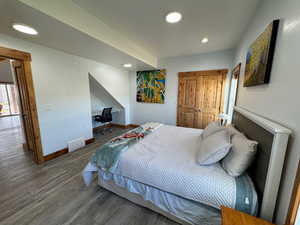 Bedroom featuring recessed lighting, wood finished floors, and baseboards